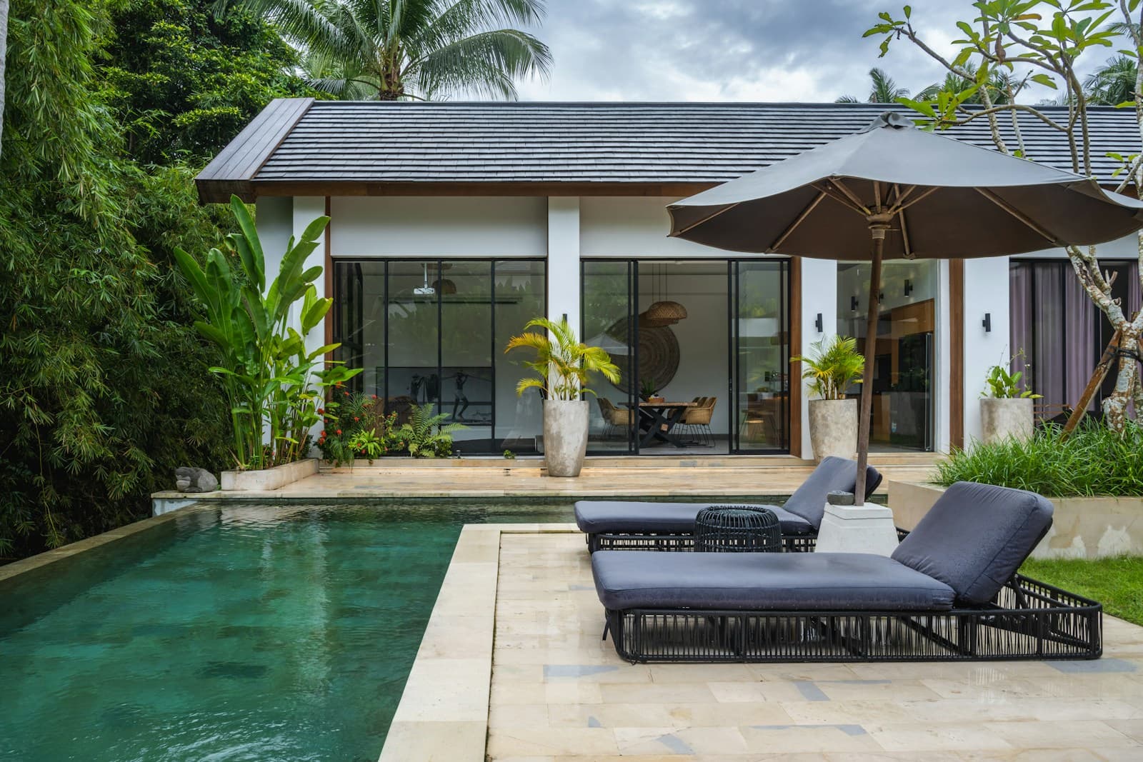 Contemporary Bali property architecture with clean lines and landscaping — atmospheric, not a listed Bali Considered property